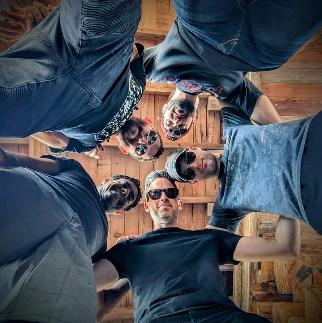 Greg Warren Band members group photo looking down at camera